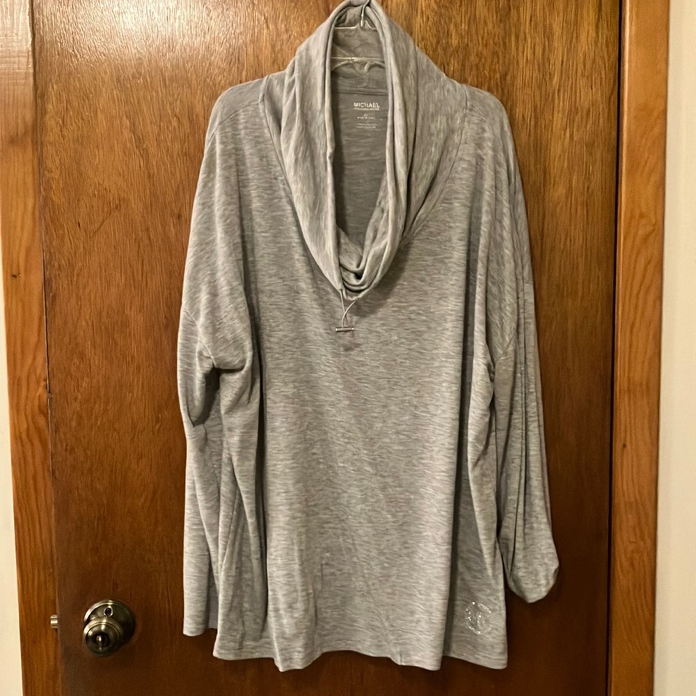 Long sleeved, cowl neck women’s top.